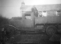 Dad & me on his Bedford lorry in our yard 1947